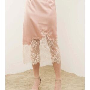 Elegant Peach Satin Skirt with Lace Trim